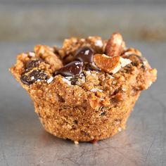 a muffin topped with nuts and chocolate