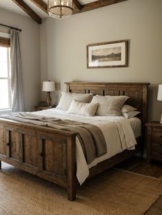 a bedroom with a bed, dresser and window