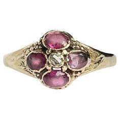 This stunner holds four deep pink tourmaline stones totalling 80pts and at the centre sits a 5pt rose cut diamond. They are set almost flush within the 15ct gold band. Ring Size: S or 9 Head Width: 10mm Weight: 2.9g Antique Wedding Ring, Antique Wedding Rings, Antique Wedding, Tourmaline Stone, Deep Pink, Enamel Jewelry, Rose Cut Diamond, Pink Tourmaline, Rose Cut