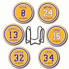 six purple and yellow basketball coasters with numbers on them