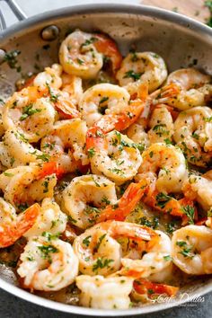 shrimp with lemon and herbs in a skillet