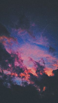 the sky is filled with stars and clouds