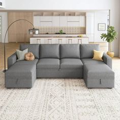 a living room with a large gray sectional couch