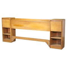 a wooden desk with two shelves on each side