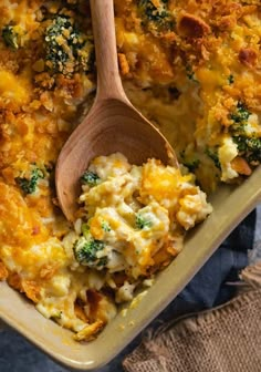 broccoli cheddar chicken and rice casserole with a wooden spoon