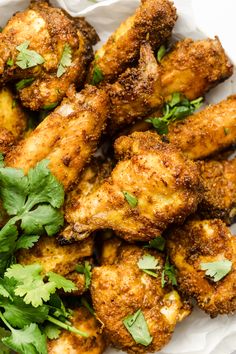 chicken wings with cilantro and parsley on top