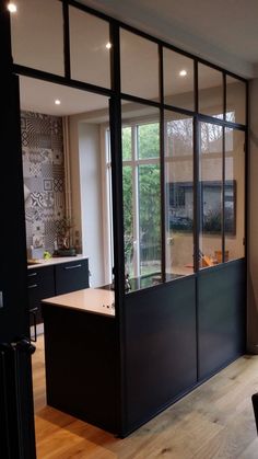 an open kitchen and dining room with sliding glass doors