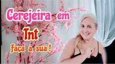 a woman is smiling and posing in front of a pink flowered tree with the words cerejeira em tint faca a sua