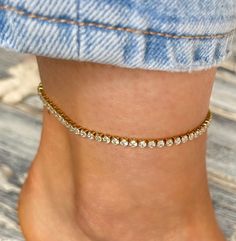 Beautiful, dainty women Tennis anklet from stainless steel with shiny Cubic Zirconia stones and 18k gold plating is made to last as it is waterproof, hypoallergenic and tarnish free. It won't make your skin green. Great for sunny days at the beach or by the pool. Could be layered with other body jewelry. Perfect peace to elevate your look! P A C K A G I N G All items will be sent in a beautiful soft Velvet pouch with a drawstring, ready for gifting or to keep for yourself.  Gift Card note with t Tennis Anklet, Dainty Women, Perfect Peace, Velvet Pouch, Anklet Jewelry, Perfect Gift For Her, Beautiful Gift Boxes, Soft Velvet, Body Jewelry