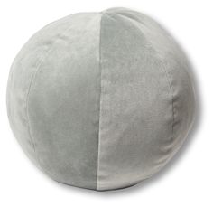 a large round pillow sitting on top of a white floor