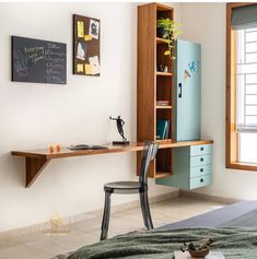 a bedroom with a desk, bookshelf and chair