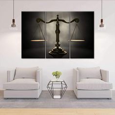 a living room with two couches and a large scale of justice on the wall