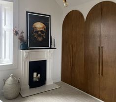 a living room filled with furniture and a fire place in front of a painting on the wall