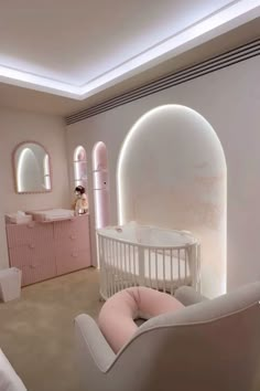 a baby's room with pink furniture and accessories