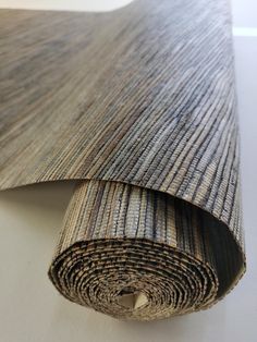 a roll of carpet on top of a white table