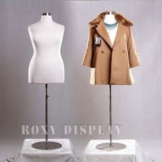 two mannequins are standing next to each other in front of a white backdrop