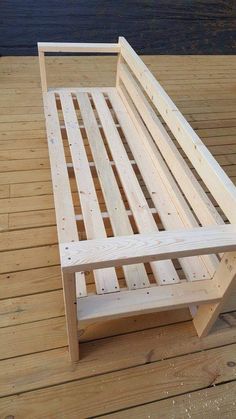 a wooden bed frame sitting on top of a wooden floor