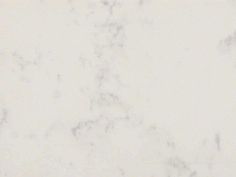 a white marble textured background with some black dots