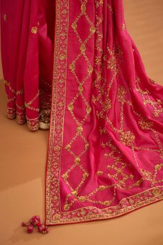 Editor's Note A fuschia pink zardozi embroidered dupion silk sari and blouse would be a stunning and bold choice for a formal occasion. The rich and luxurious fabric of the dupion silk would dr... Designer Pink Pre-draped Saree With Zari Work, Pink Art Silk Pre-draped Saree With Intricate Embroidery, Silk Salwar Kameez With Dori Work For Reception, Pink Silk Bollywood Pre-draped Saree, Festive Pink Pre-draped Saree With Dori Work, Silk Saree With Pallu For Reception, Elegant Tussar Silk Pre-draped Saree With Dori Work, Pink Anarkali Style Silk Pre-draped Saree, Silk Saree With Zari Weaving For Reception