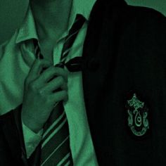 a man wearing a harry potter shirt and tie