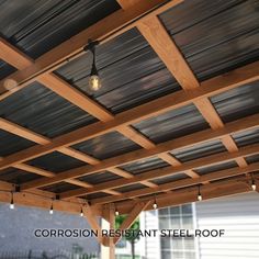 an outdoor covered patio with lights hanging from the ceiling and wood slats on the roof