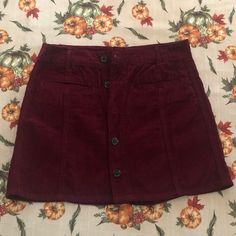 Maroon Corduroy High-Rise Skirt From American Eagle With Buttons (Instead Of Zipper). Size 6. Bought This And It Didn’t Fit Me Right So I Haven’t Worn It. Maroon Skirt, High Rise Skirt, Corduroy Skirt, American Eagle Outfitters, American Eagle, Womens Skirt, High Rise, Size 6, Zipper