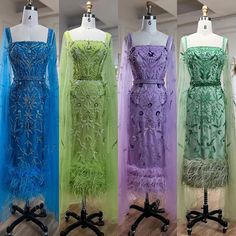 four dresses on mannequins in different colors