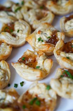 small appetizers are arranged on a white plate