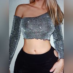 New Never Worn Shein Icon Asymmetrical Silver Neck Lettuce Trim Glitter Crop With Sleeves Top Large Shoulder 15.4/Length 16.7/Sleeve Length 25.6/Bust 35/Cuff 8.1/Bicep Length 12.4 67% Polyester Metalized Fibres 33% Stretch One-shoulder Crop Top For Party, Trendy Metallic Tops For Evening, Trendy Metallic Top For Evening, Shiny Tops For Night Out Party Season, Glamorous Shiny Tops For Spring, Trendy Metallic Tops For Party, Shiny Tops For Party Season, Spring Club Tops With Shiny Details, Shiny Club Tops For Spring