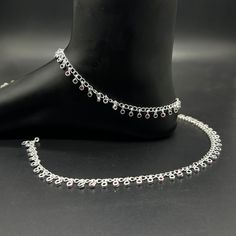 Name of product: 925 Sterling Silver Light Weight Anklet / Silver Payal Weight: 19 grams. Length: 26.8centimeter -----Feedback::- A satisfied customer is our top priority and your feedback forms the backbone of our success. Don't forget to give positive feedback along with good ratings. Thank You Elegant Silver Anklets With Latkans, Silver Anklets With Latkans As A Gift, Silver Sterling Silver Anklets For Parties, Bride Payal, Payal Silver, Payal Designs Silver, Silver Payal, Anklet Silver, Anklet Designs