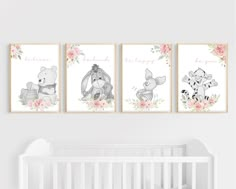 three winnie the pooh prints hanging on a wall next to a baby crib