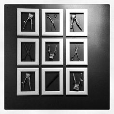 six framed photographs with scissors and wire attached to each other on a black wall in front of a white frame