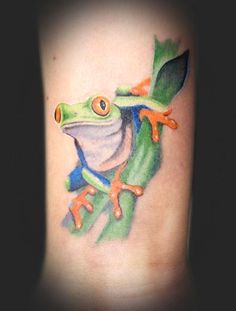 a frog with a leaf on its back is shown in this tattoo art photo shoot