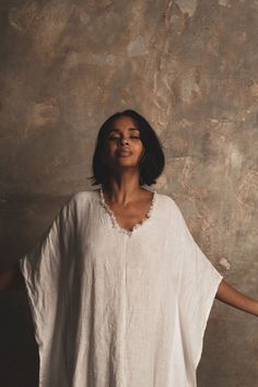 ‘Let There Be Peace’ our biggest dream. This kaftan is crafted from white organic flax linen with raw rustic edging to the neck and front split. We love the simplicity and message of this piece. The feeling of freedom One Size Cut for a relaxed fit. 100% Linen Dry Clean Only. Handmade by artisans. Female Portrait Photography, Dress Cream, Cream Dress, Sewing Clothes, Female Portrait, Resort Wear, Minimalist Fashion, Boho Fashion, Portrait Photography