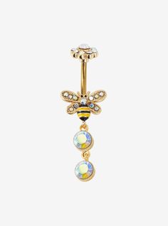 a gold colored belly ring with a bee and crystal stones on the bottom, attached to a