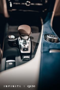 the interior of a car with an automatic gear box and control knobs in it