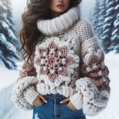 a woman is standing in the snow with her hands on her hips wearing a sweater and jeans