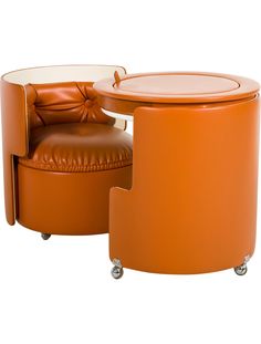 an orange leather chair and ottoman with wheels