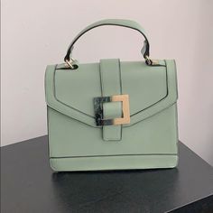 Nice Mint Green Handbag. Great Color For Any Season. Never Worn. Green Crossbody Bag With Hasp Closure, Green Satchel With Hasp Closure, Chic Green Bag With Detachable Strap, Chic Box Bag With Gold-tone Hardware, Chic Box Bag With Gold-tone Hardware For Errands, Everyday Green Satchel With Hasp Closure, Gold-tone Hardware Satchel Bag For Day Out, Satchel With Top Carry Handle For Day Out, Chic Satchel Bag With Fold Over Clasp