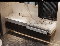 a bathroom with marble counter tops and black shutters on the window sill above it