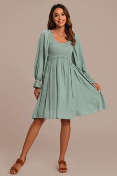 Casual V-neck Peasant Dress For Spring, Spring V-neck Dress With Smocked Cuffs, Solid V-neck Midi Dress With Smocked Back, Flowy V-neck Dress With Smocked Cuffs, Fall V-neck Ruched Smocked Top, Elegant V-neck Smocked Dress For Brunch, Flowy Smocked Dress With Empire Waist, Solid Flowy Smocked Dress For Spring, Flowy Solid Smocked Dress For Brunch