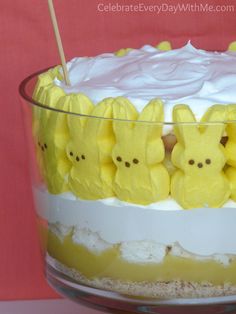 a cake decorated with peep holes and icing in a glass bowl on a table