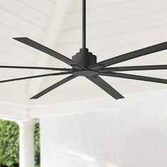 an outdoor ceiling fan with black blades