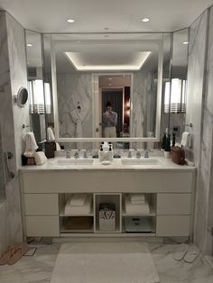 a large bathroom with marble walls and floor