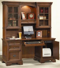 a computer desk with a hutch on top and two drawers underneath the hutch