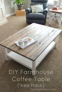 a coffee table that is made out of pallet wood and has two cups on it