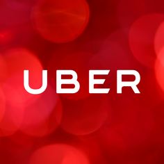 the word uber is written in white on a red background with boket