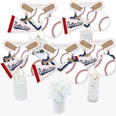 baseball themed centerpieces are arranged in vases and on sticks with flowers inside