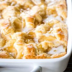 a casserole dish filled with bananas and cream