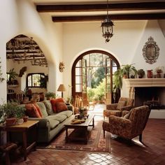 a living room filled with furniture and a fire place next to a doorway that leads to an outside patio